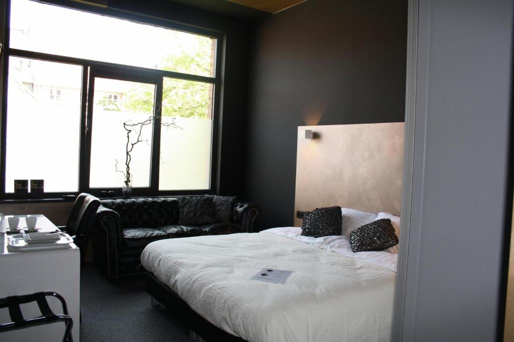 Postel nebo postele na pokoji v ubytování Hotel Moon