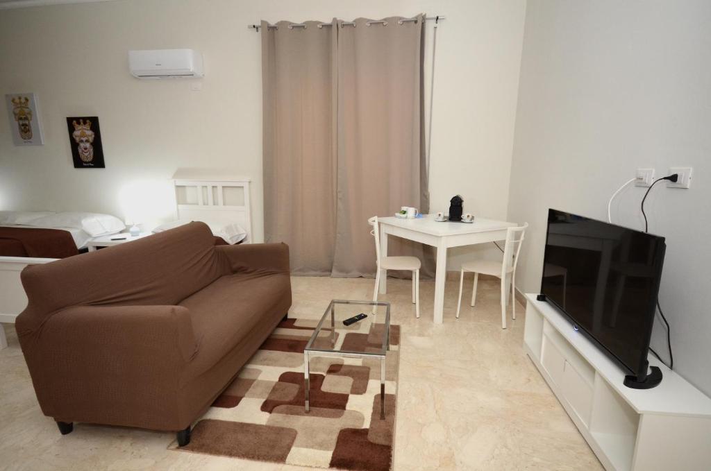 Televízia a/alebo spoločenská miestnosť v ubytovaní La Casa del Moro - Al Politeama