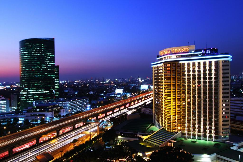 a view of a large building in a city at night at Centara Grand at Central Plaza Ladprao Bangkok in Bangkok