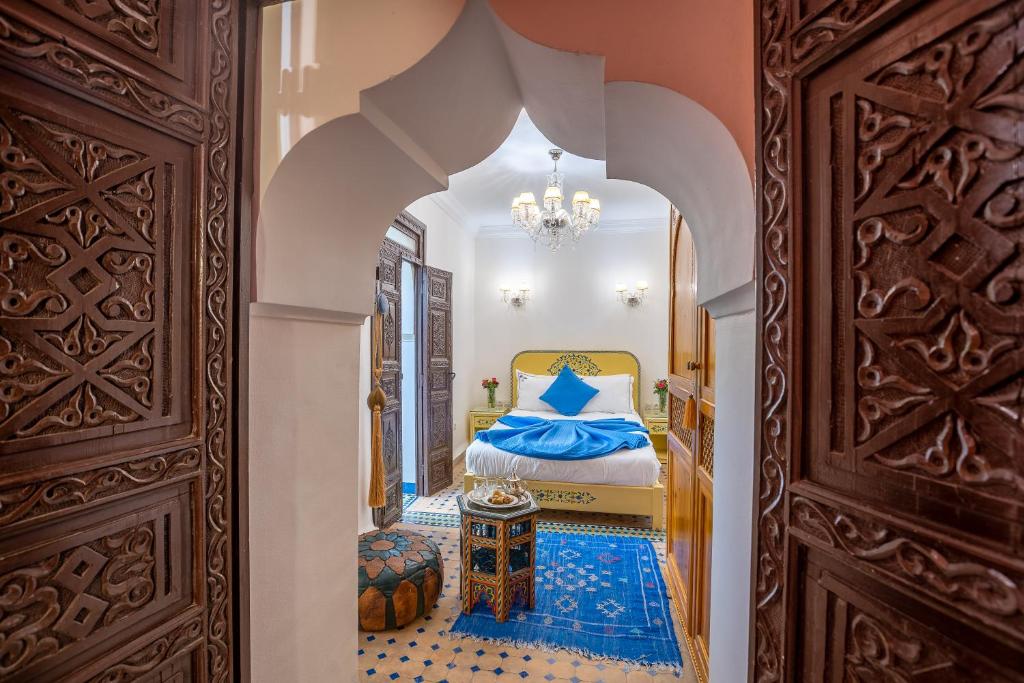 Postel nebo postele na pokoji v ubytování Riad Ben Tachfine
