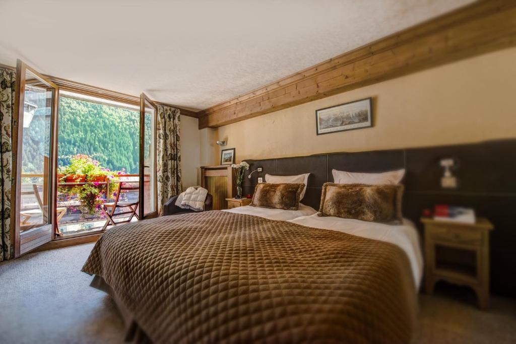 Postel nebo postele na pokoji v ubytování Park Hotel Suisse & Spa