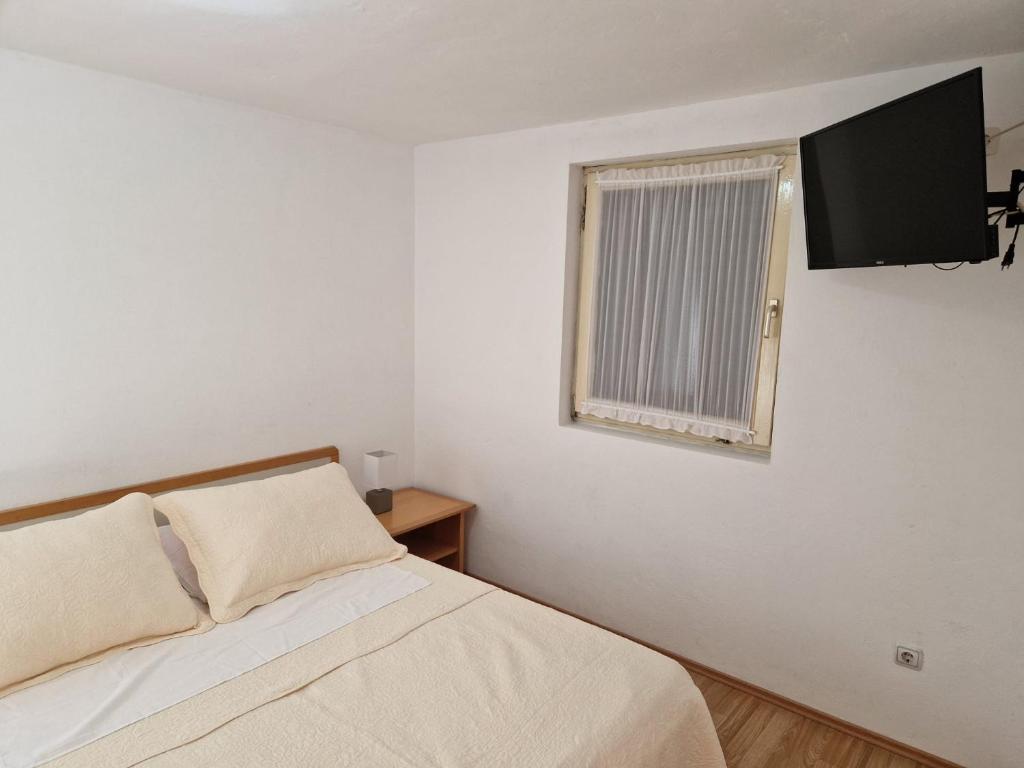 Postel nebo postele na pokoji v ubytování Apartment Misic