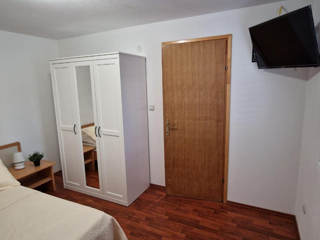 Postel nebo postele na pokoji v ubytování Apartment Misic