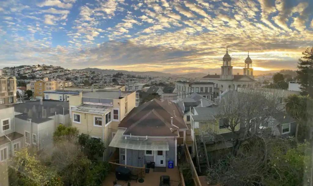 a view of a city with a cloudy sky at Beautiful 3 Bed 3 Bath upper house in Bernal Glen in San Francisco