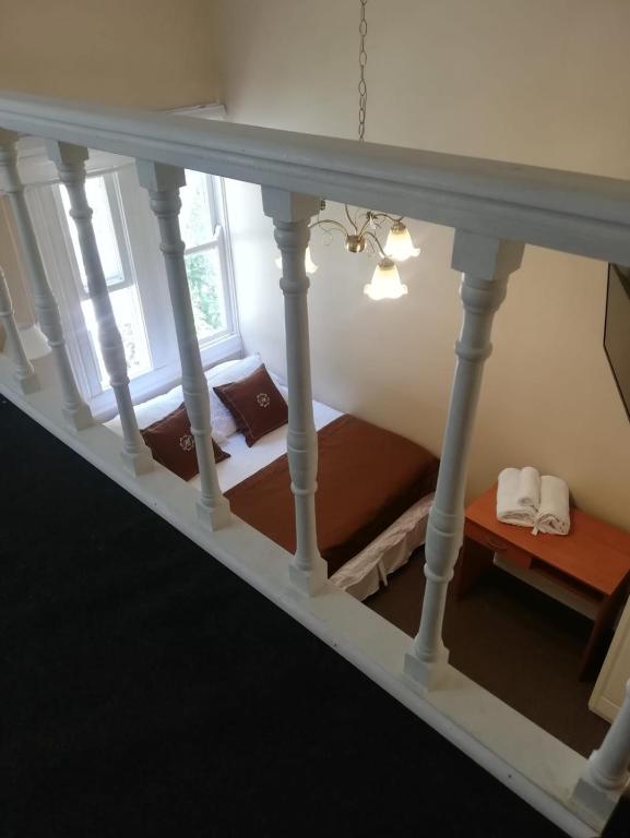 Postel nebo postele na pokoji v ubytování Belle Epoque Hostal