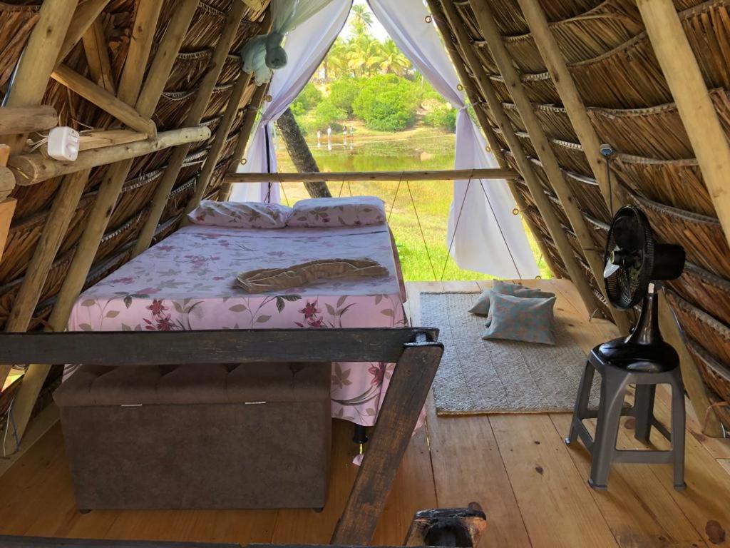 Postel nebo postele na pokoji v ubytování JARDIM ENCANTADO ECOHOSPEDARIA