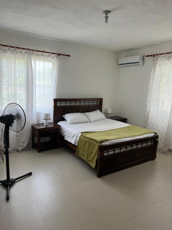 En eller flere senge i et værelse på Villa La Esperanza