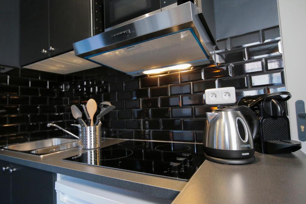 Kuchyňa alebo kuchynka v ubytovaní L'Eléphant, T2 hypercentre chic et cosy, Wifi par SOVALFI