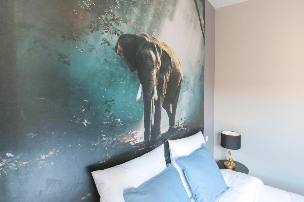 Posteľ alebo postele v izbe v ubytovaní L'Eléphant, T2 hypercentre chic et cosy, Wifi par SOVALFI