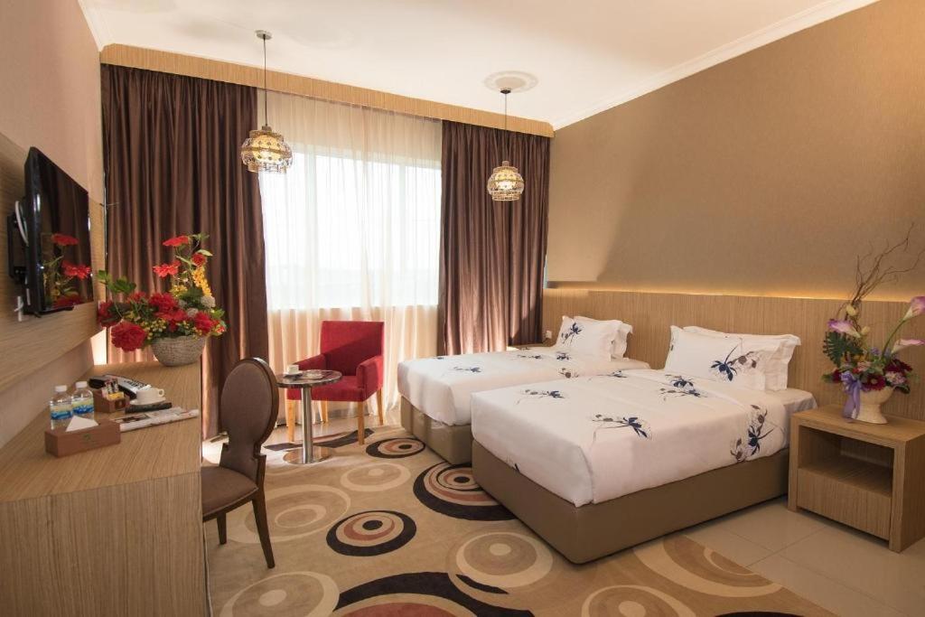 Postel nebo postele na pokoji v ubytování Hotel Holmes Gp