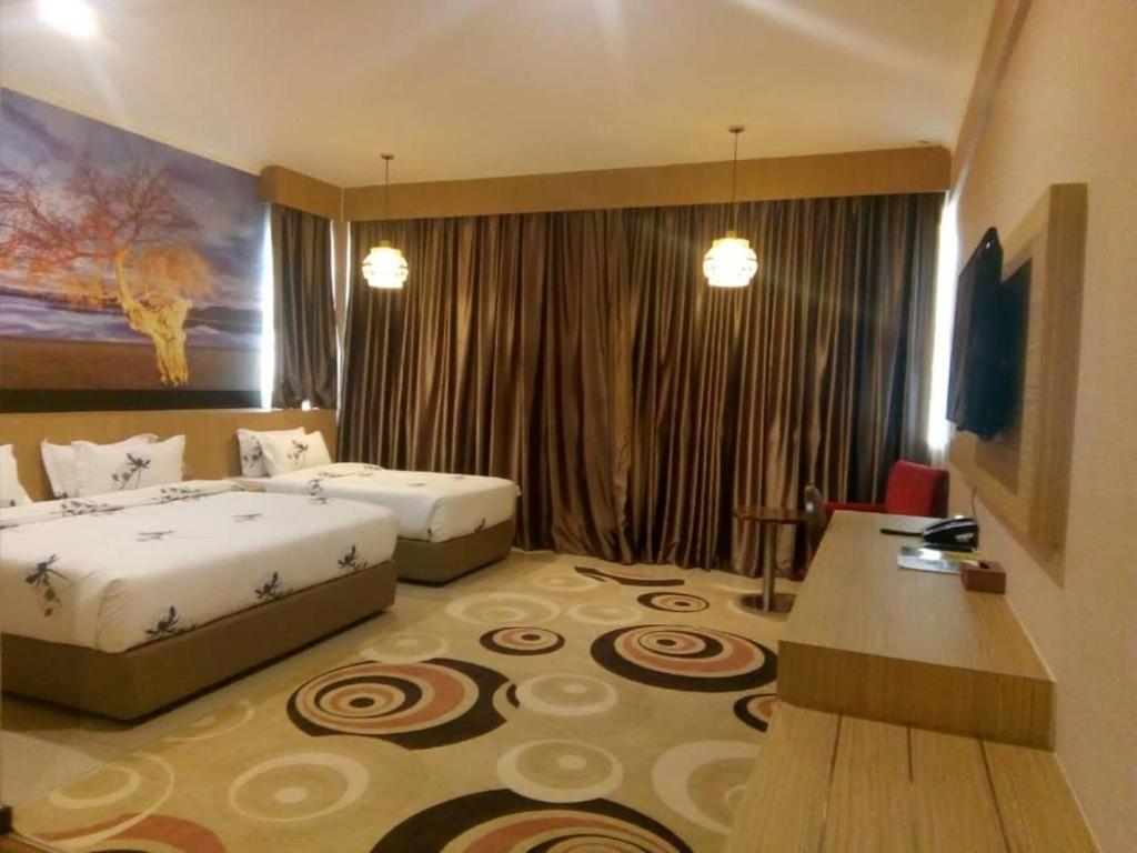 Postel nebo postele na pokoji v ubytování Hotel Holmes Gp