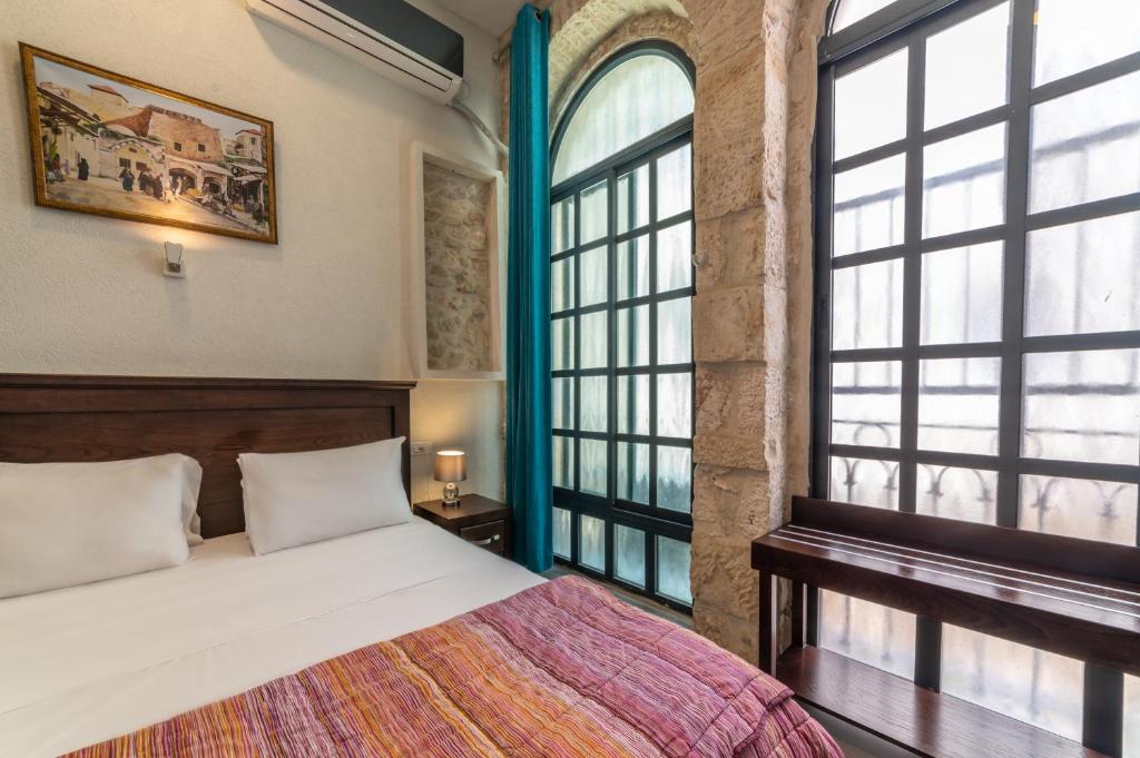 Postel nebo postele na pokoji v ubytování New Imperial Hotel