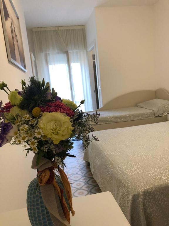 Postel nebo postele na pokoji v ubytování Hotel Calypso