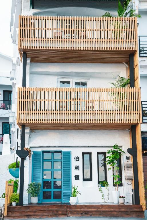 a house with a wooden deck on top of it at Bethlehem B&amp;B Kenting in Eluan