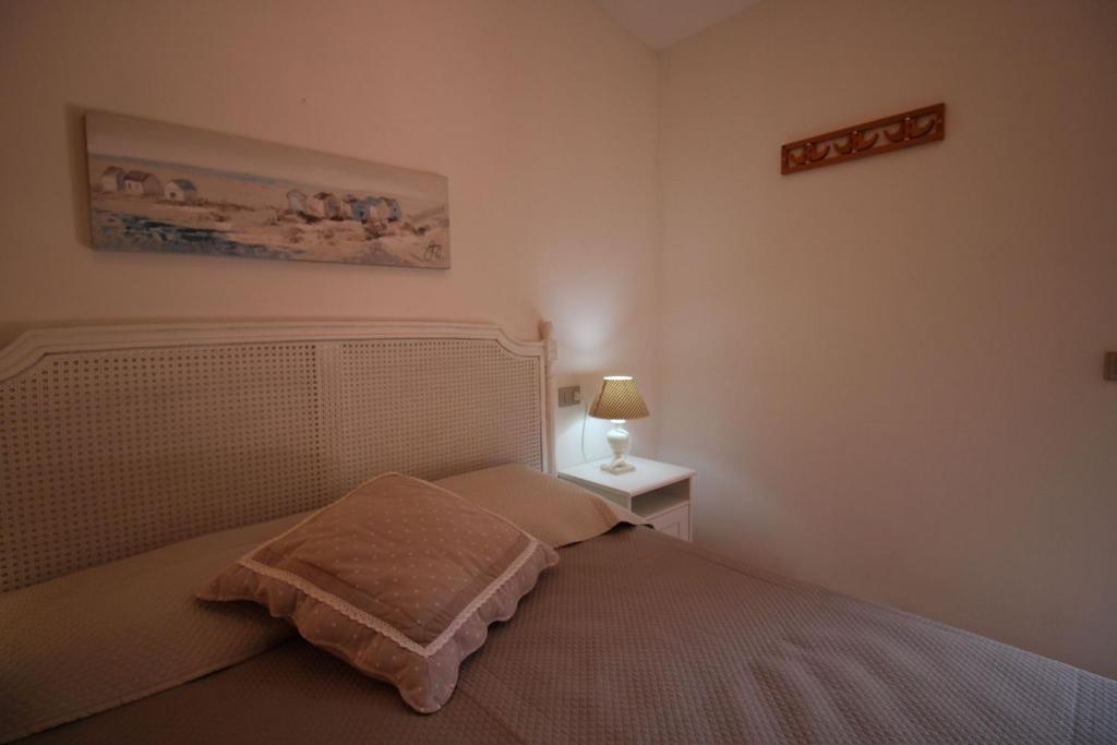 Łóżko lub łóżka w pokoju w obiekcie Casa Mira con piscina e bellissima vista mare