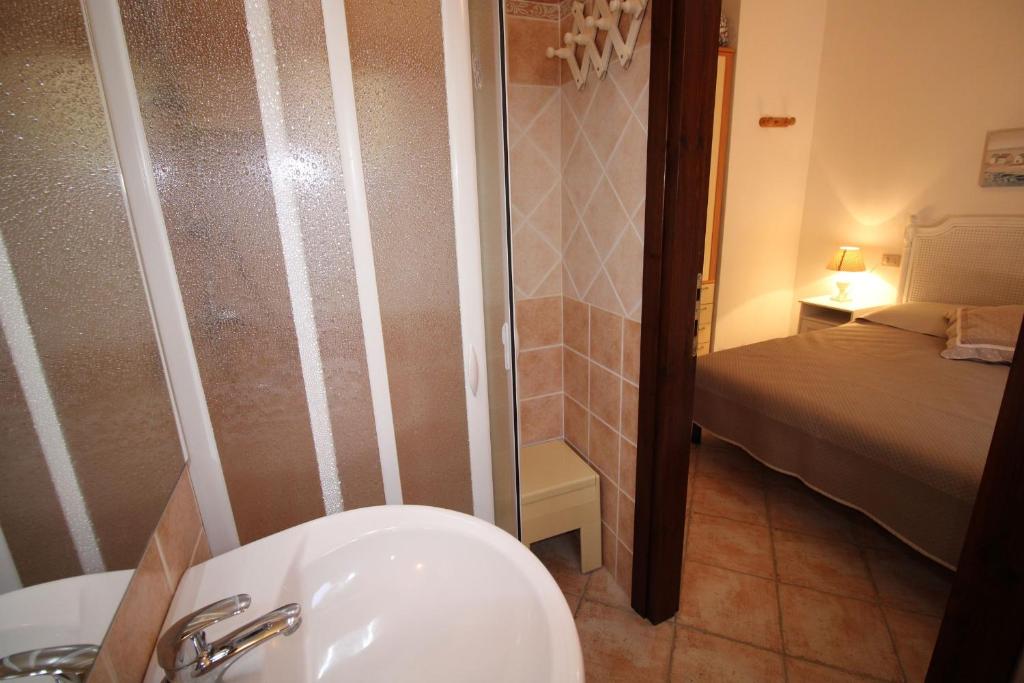Łóżko lub łóżka w pokoju w obiekcie Casa Mira con piscina e bellissima vista mare