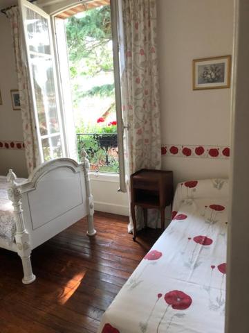 Postel nebo postele na pokoji v ubytování Le clos st Justin