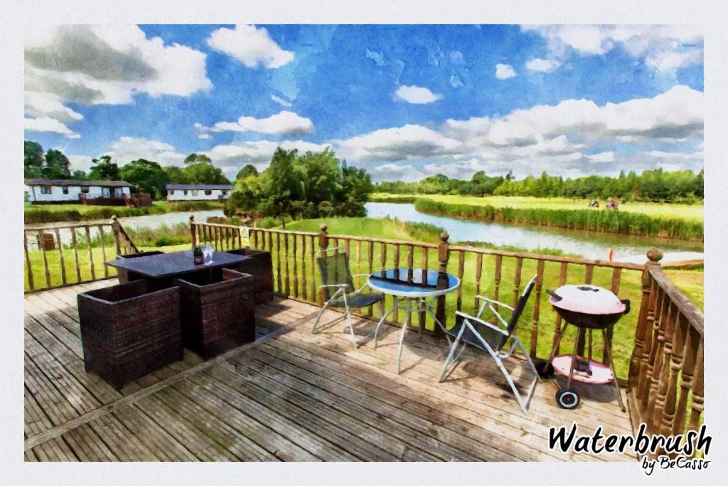 a painting of a deck with a table and chairs at Augusta Dreams in Tydd Saint Giles