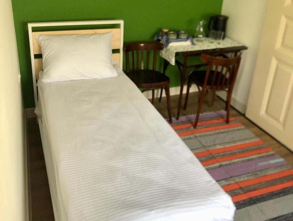 Postel nebo postele na pokoji v ubytování Communa Guesthouse