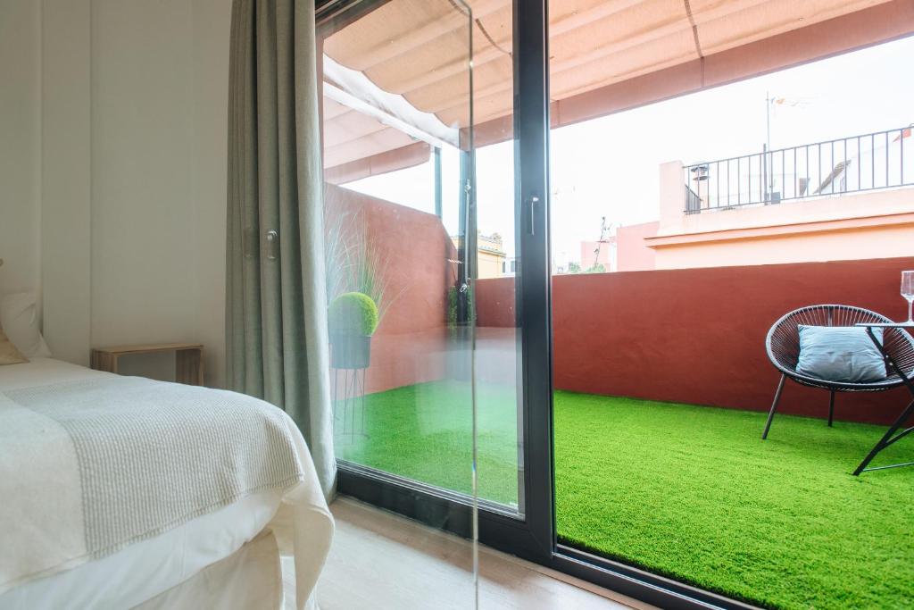 Łóżko lub łóżka w pokoju w obiekcie Guardamino Dúplex Suite Apartment