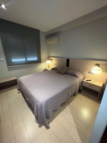 Postel nebo postele na pokoji v ubytování Hostal Crisami