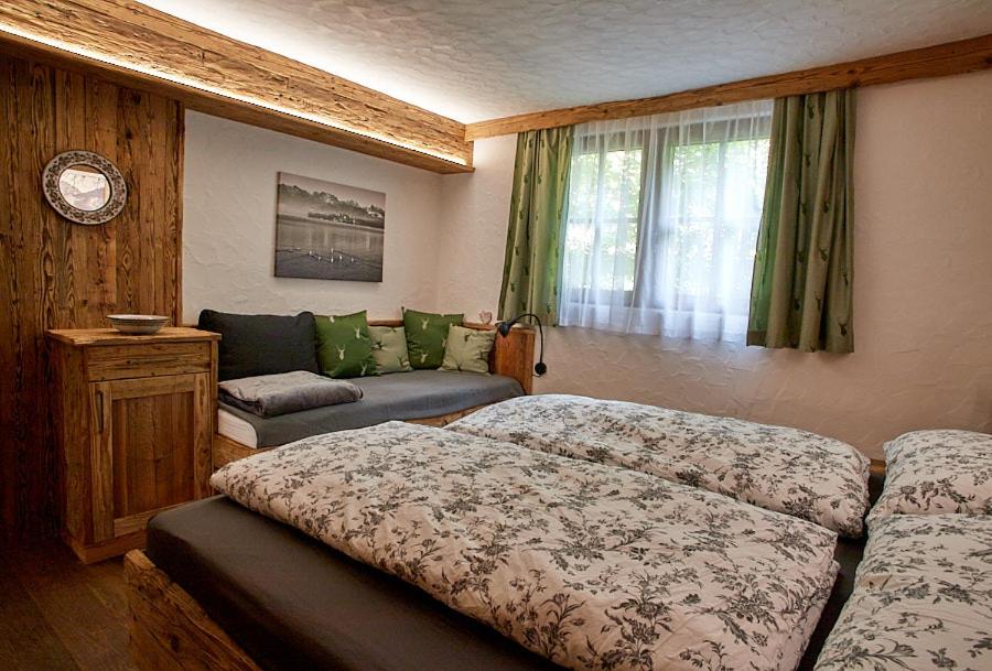 Postel nebo postele na pokoji v ubytování Keramikhaus Gmunden