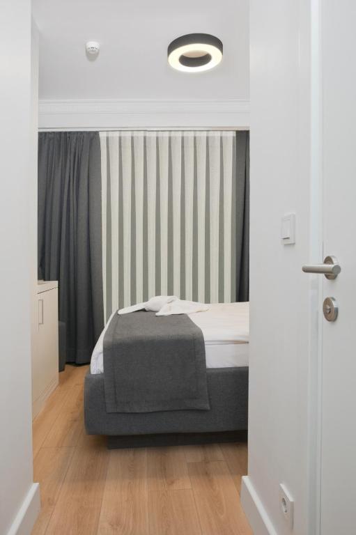 A bed or beds in a room at Silvana Hotel