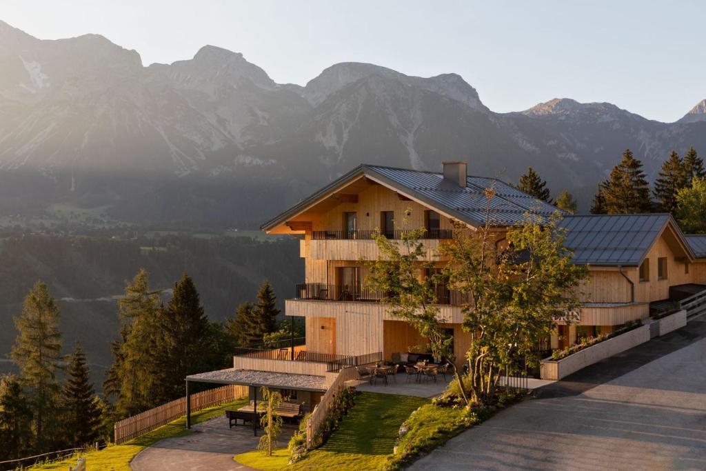 a house with a view of a mountain at Holzhackerin - the charming Haus am Berg in Schladming