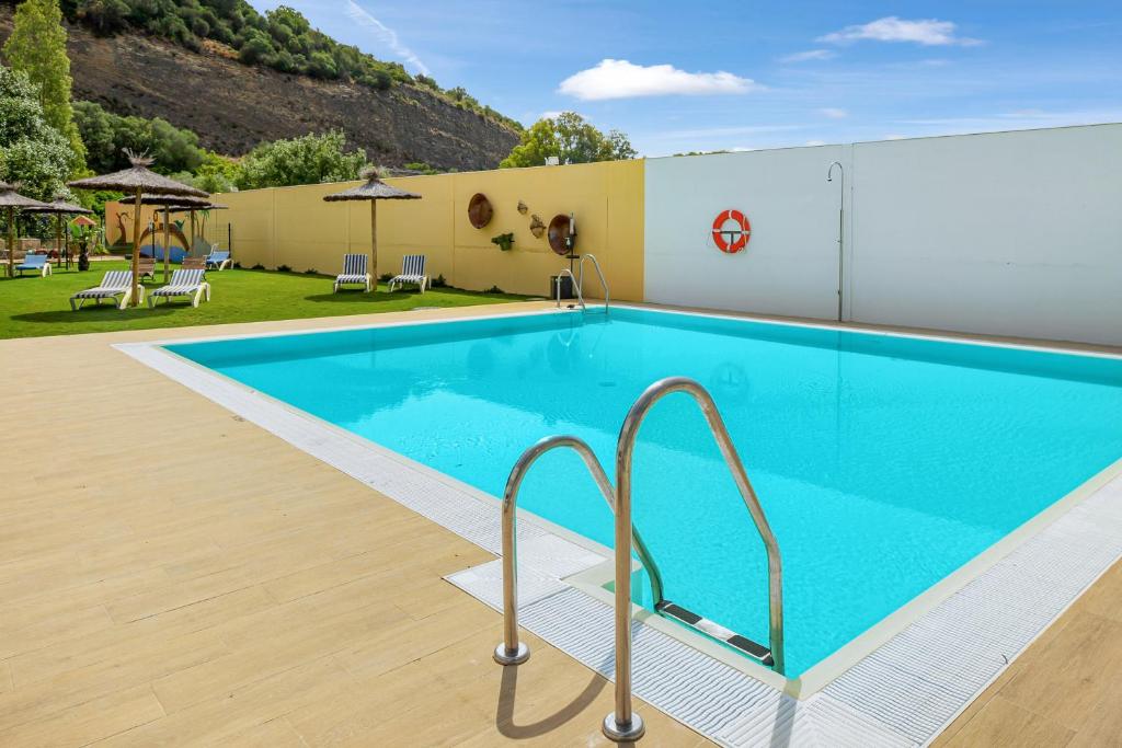 Bazén v ubytování Casa de 10 - 4b nebo v jeho okolí