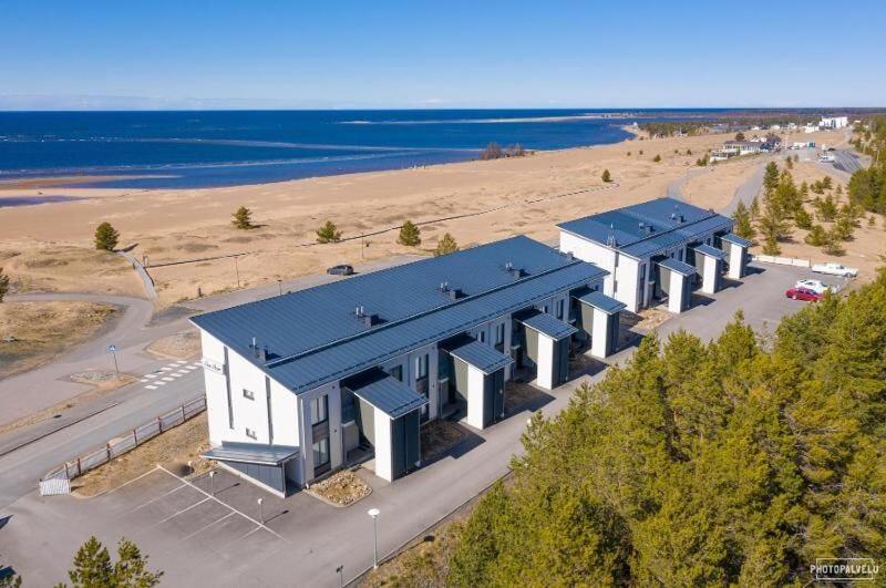 an aerial view of a building next to a beach at Merihelmi in Kalajoki