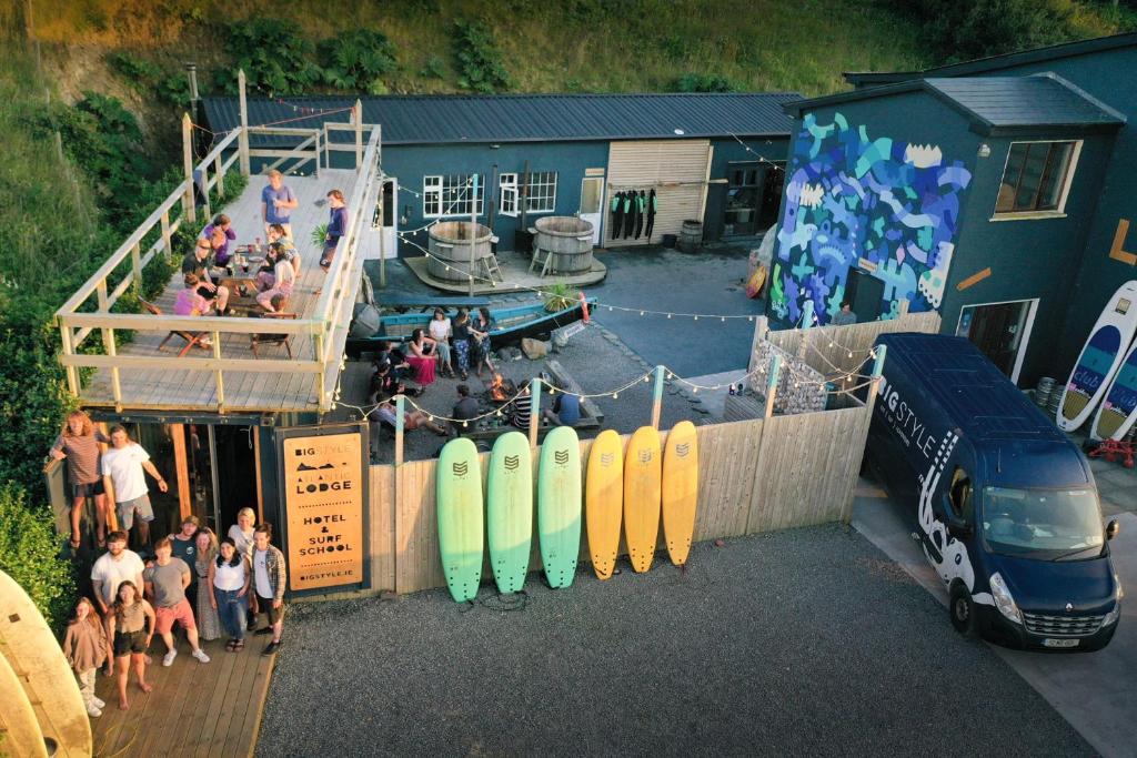 a group of people standing in front of surfboards at BigStyle Atlantic Lodge 