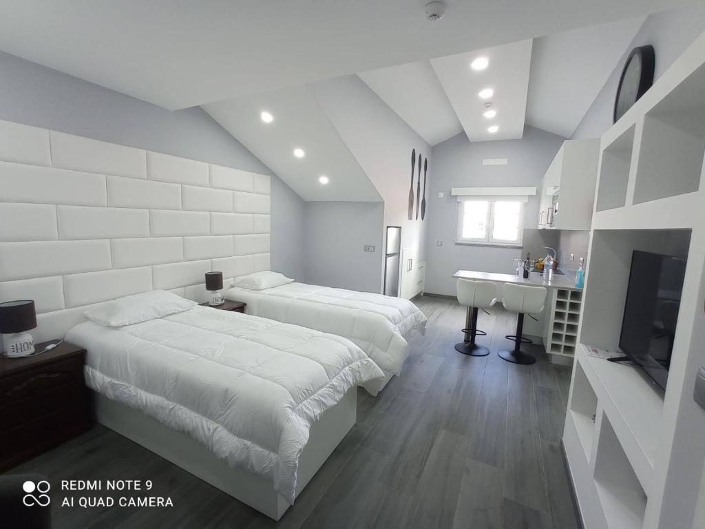 Postel nebo postele na pokoji v ubytování Casa Rua Velha