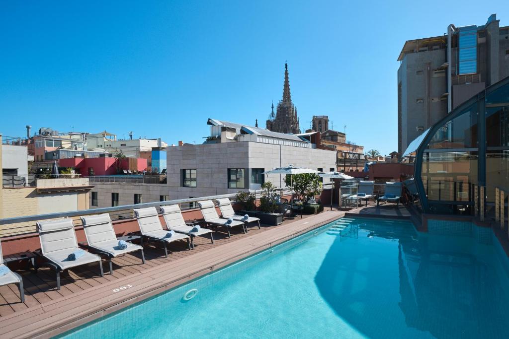 a swimming pool on the roof of a building at Catalonia Catedral in Barcelona
