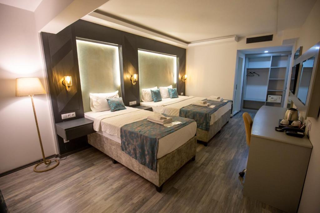 Postel nebo postele na pokoji v ubytování ANYA RESORT HOTEL