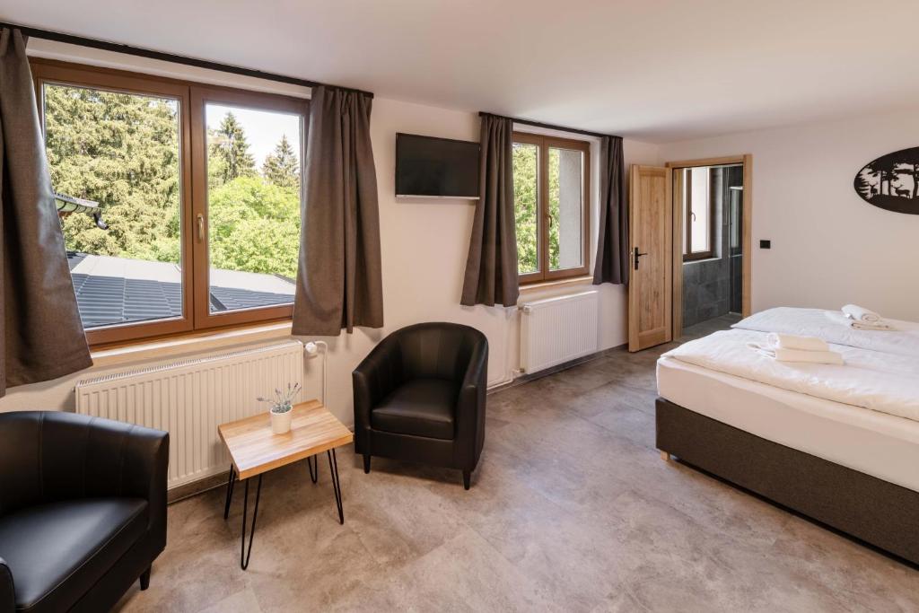 Postel nebo postele na pokoji v ubytování Wellness aparthotel Martiňák