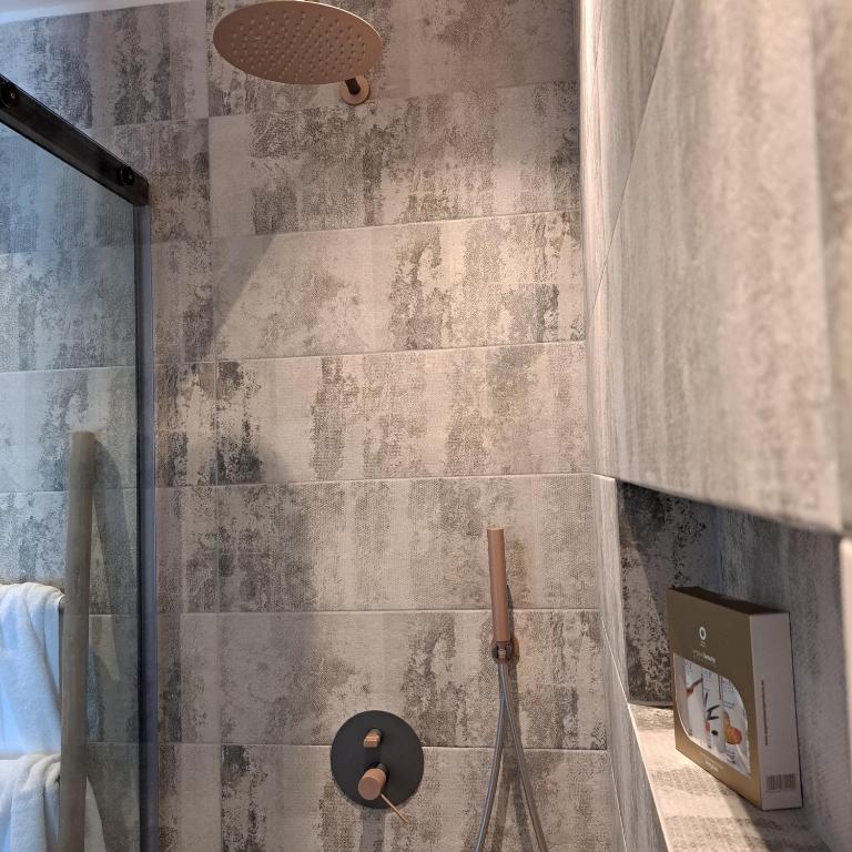 Koupelna v ubytování Nisaki Hotel & Elite Suites