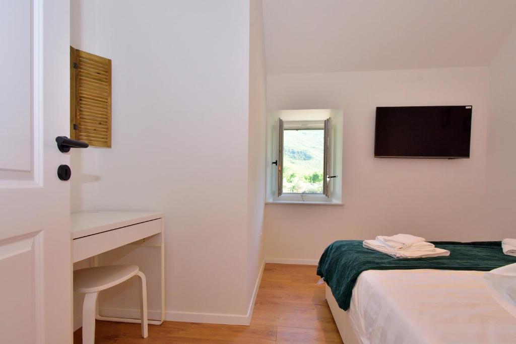 Posteľ alebo postele v izbe v ubytovaní Charming and Authentic Stone Villa Stanić