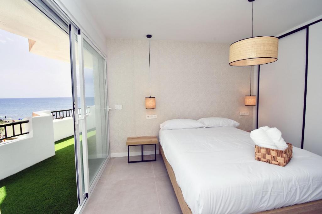 Postel nebo postele na pokoji v ubytování Apartamento amanecer