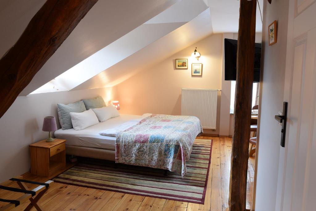 Postel nebo postele na pokoji v ubytování Guest House Wiejska Sielanka