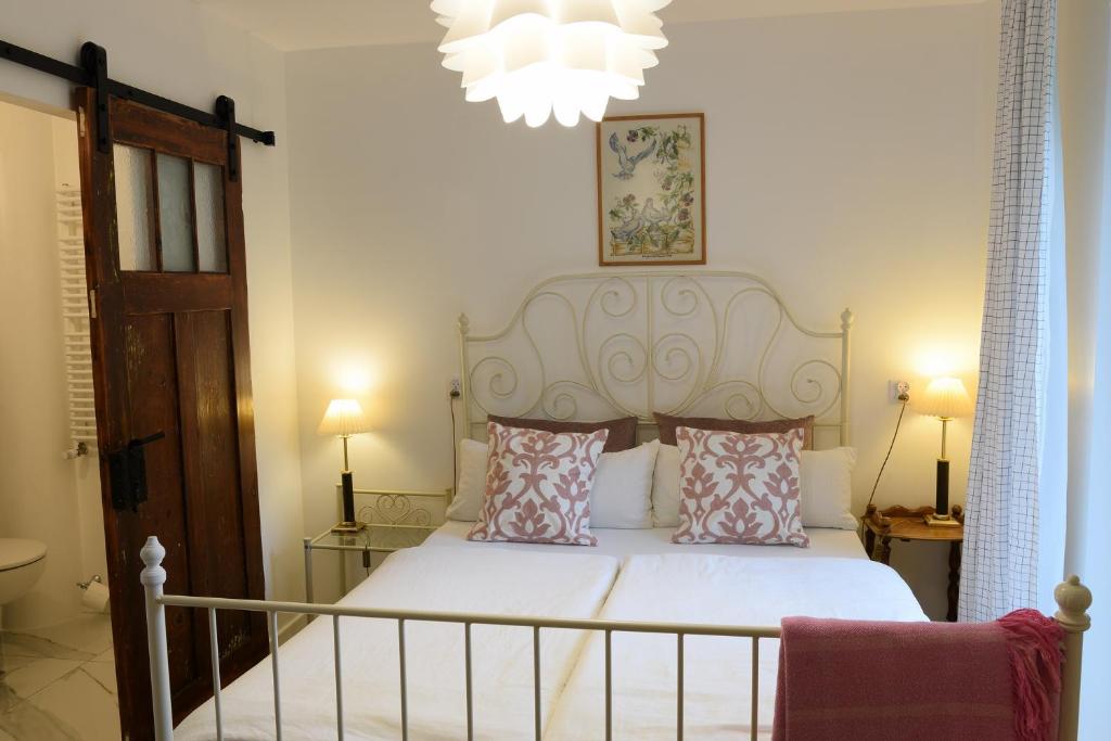 Postel nebo postele na pokoji v ubytování Guest House Wiejska Sielanka