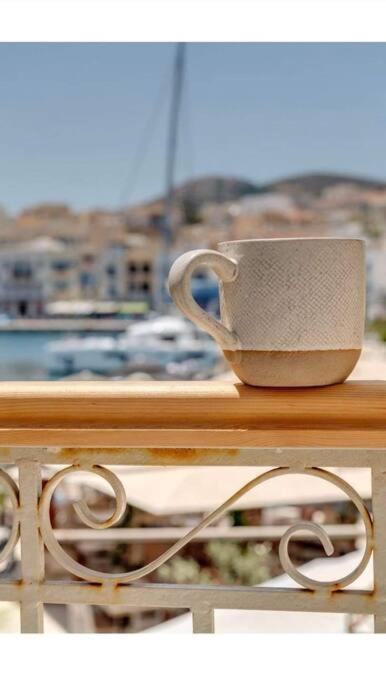 a coffee cup sitting on top of a table at Nomade vibrant living loft in Ermoupoli