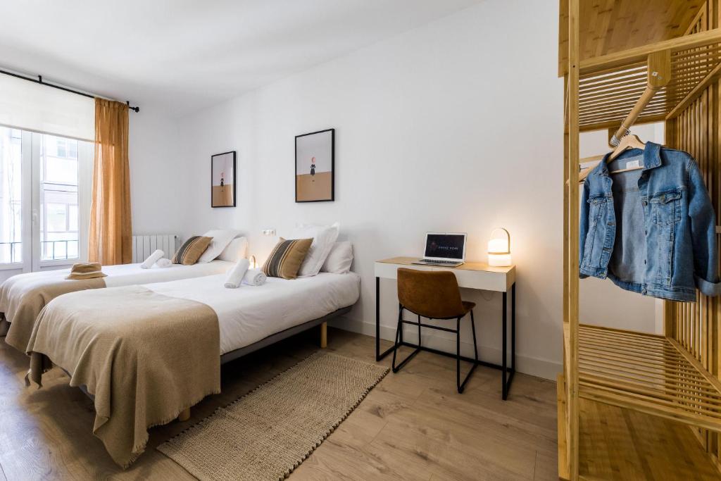 Posteľ alebo postele v izbe v ubytovaní GETARIA by SWEET HOME SAN SEBASTIAN