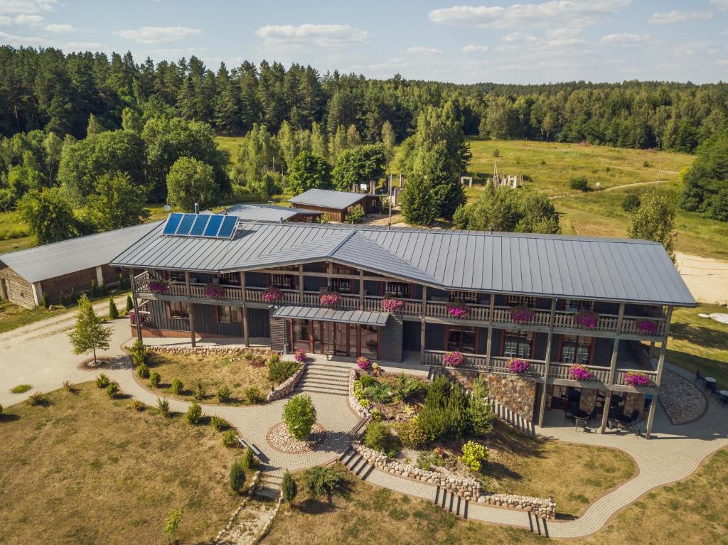 an overhead view of a large building with a garden at Luokesų Dvaras in Molėtai