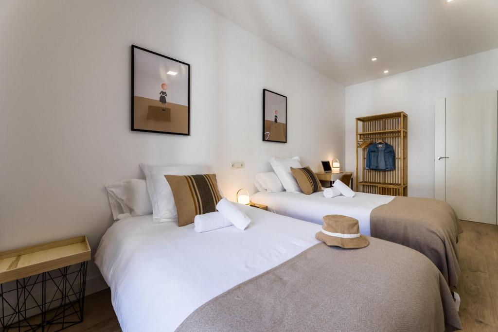 Posteľ alebo postele v izbe v ubytovaní GETARIA by SWEET HOME SAN SEBASTIAN