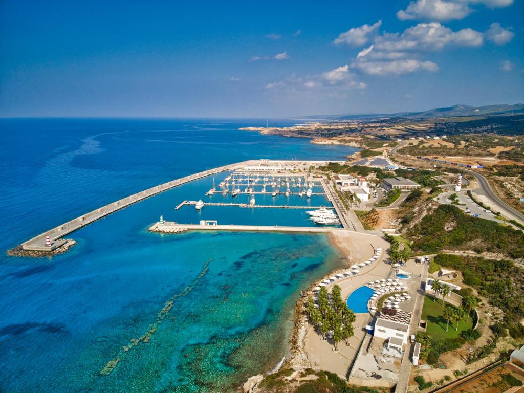 an aerial view of a marina with boats in the water at Karpaz Gate Marina Hotel in Ayia Trias
