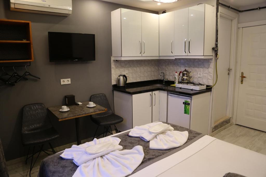 Kuchyň nebo kuchyňský kout v ubytování Arat Apartments