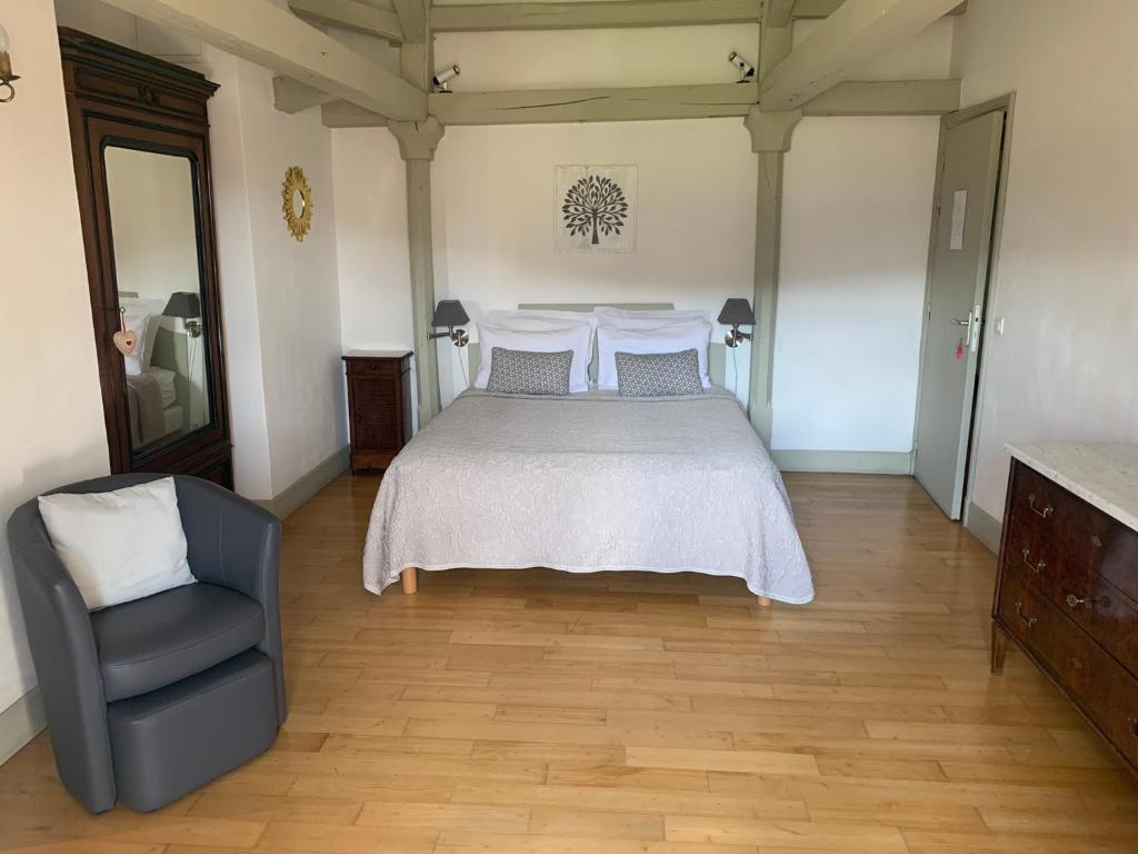 Postel nebo postele na pokoji v ubytování Chambres d'hôtes Maison Redon