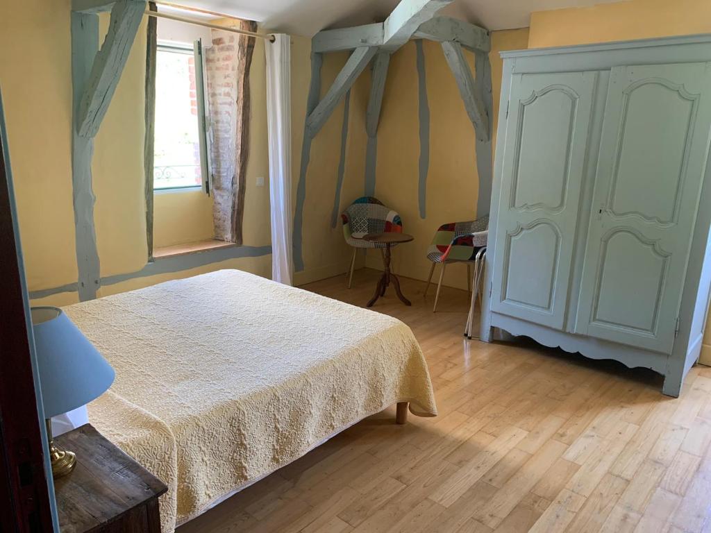 Postel nebo postele na pokoji v ubytování Chambres d'hôtes Maison Redon
