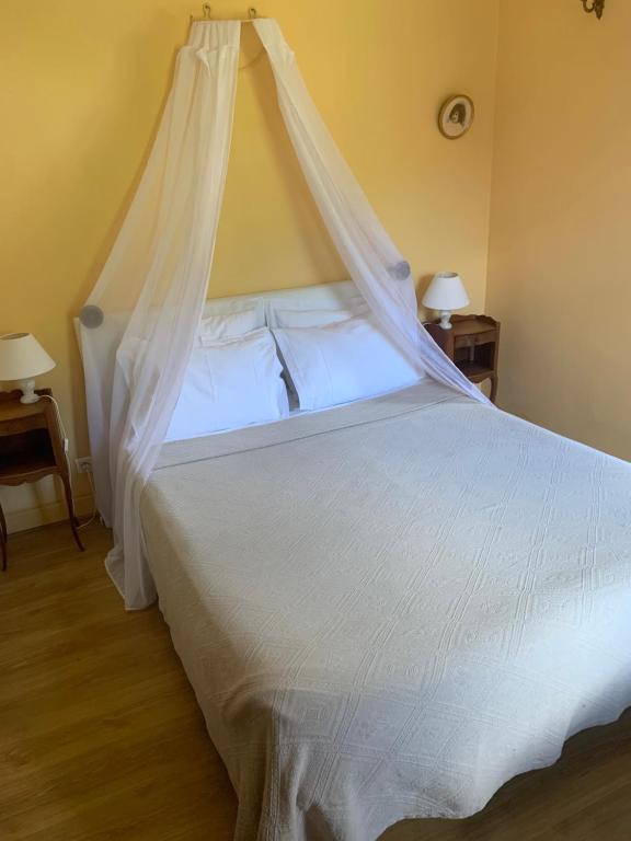 Postel nebo postele na pokoji v ubytování Chambres d'hôtes Maison Redon