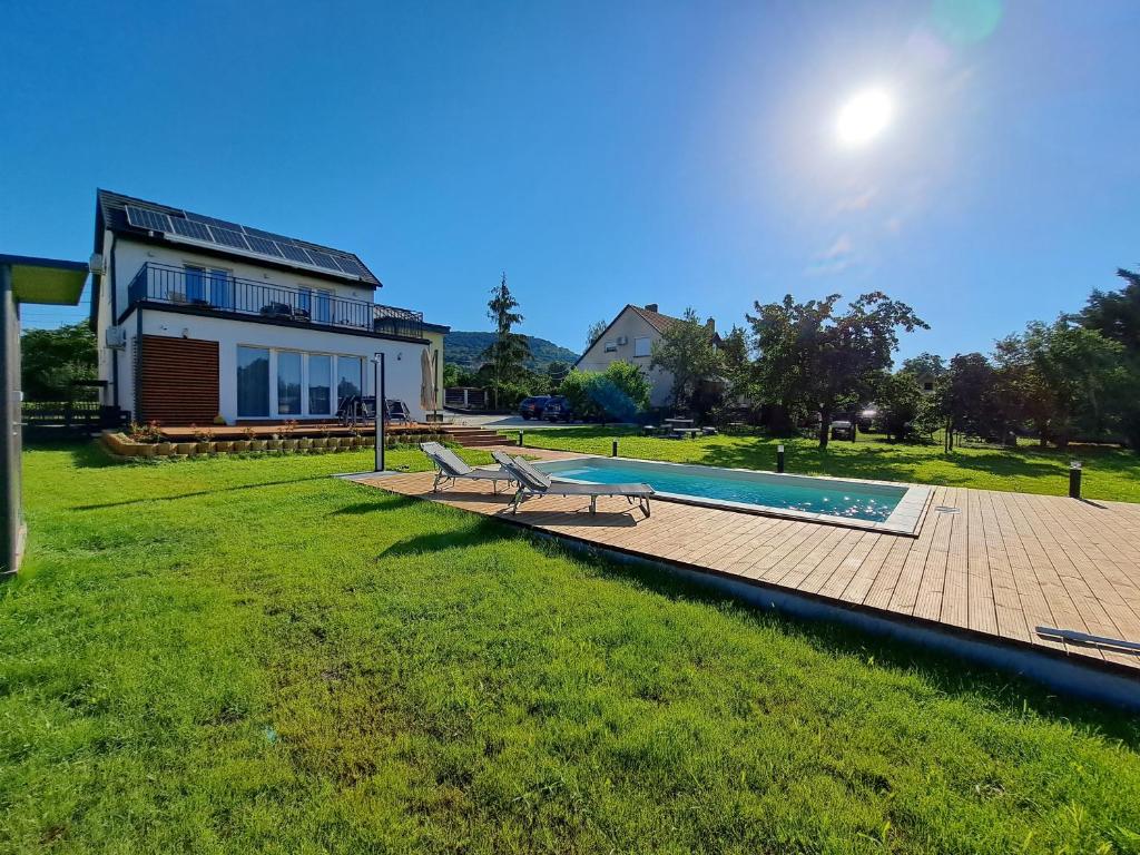 a house with a swimming pool in the yard at Villa Field6 in Révfülöp